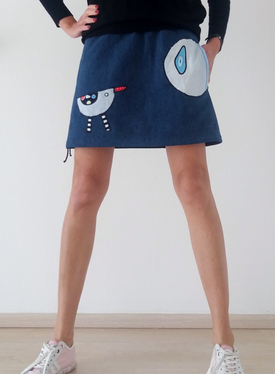 Jeansová sukně s ptáčkem a kapsou