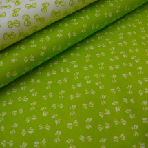 Bavlněná látka - metráž - bílé mašličky na zelené - š. 150 cm