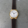 Náramkové hodinky Prim, zlacené pouzdro, z roku 1974