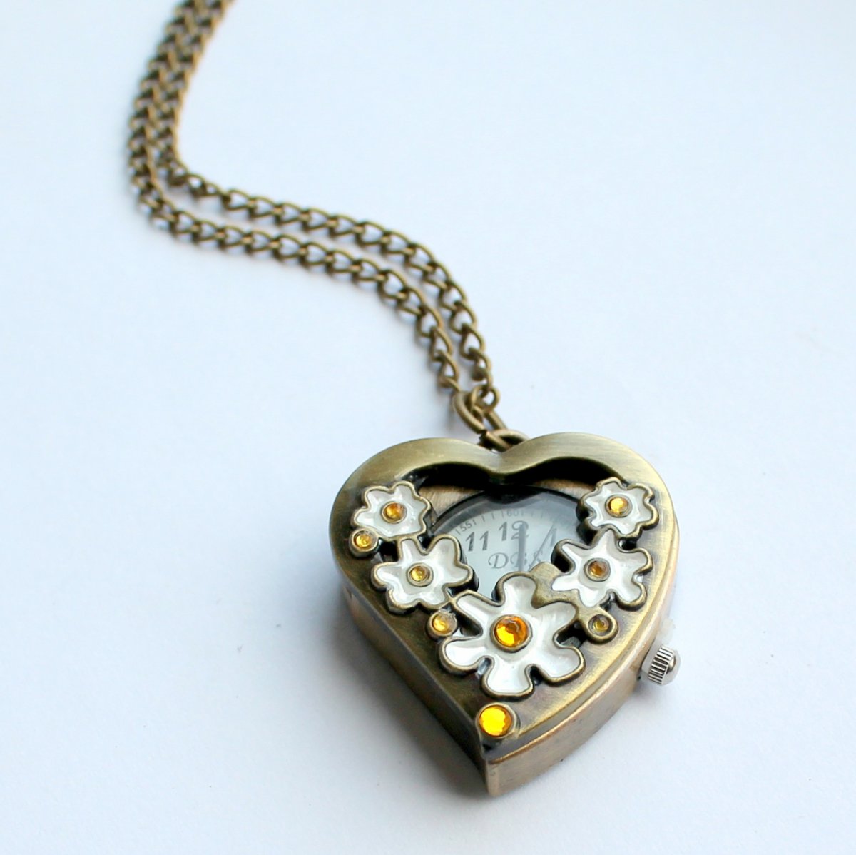 Květinkové bronzové hodinky