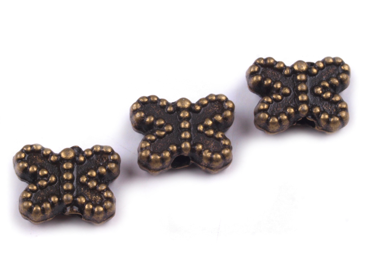 Kovový korálek motýlek 5x7mm - 10 ks - staromosaz