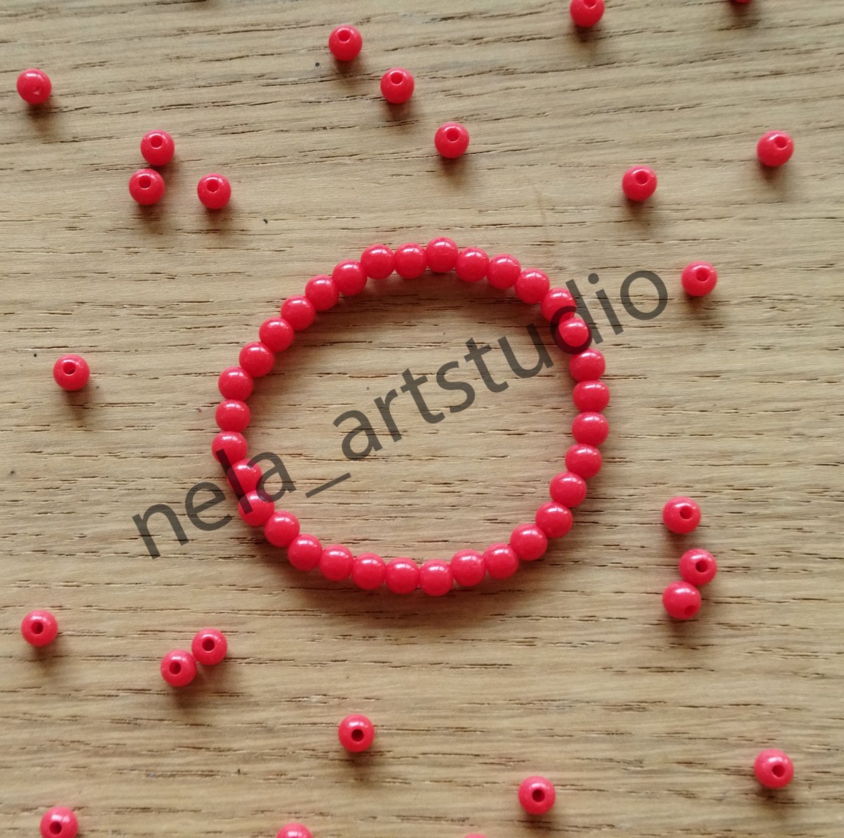 Náramek kulička červený